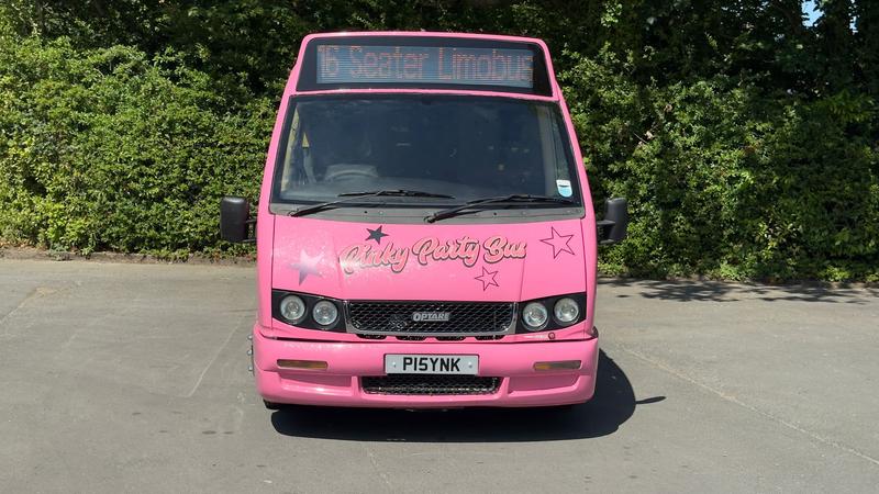Pink party bus front exterior - luxury nightclub on wheels for hire