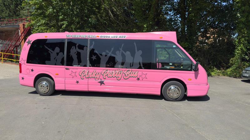 Pink party bus right side view - professional party hire service
