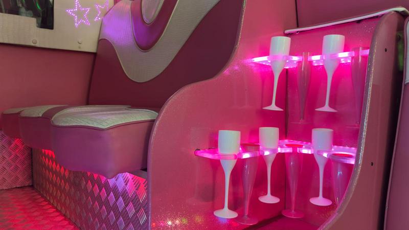 Pink party bus champagne service - premium party experience